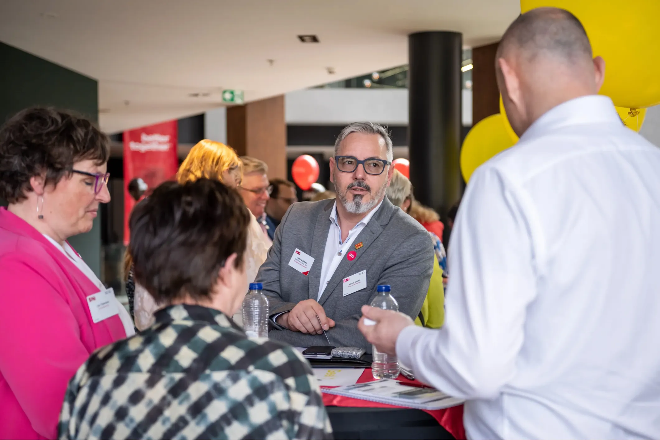Event photo of a group networking at a BNI conference
