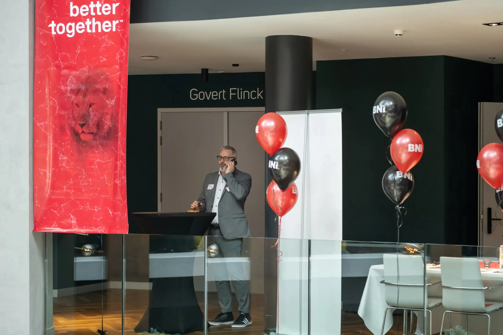 Event photo of a man on the phone at a BNI conference