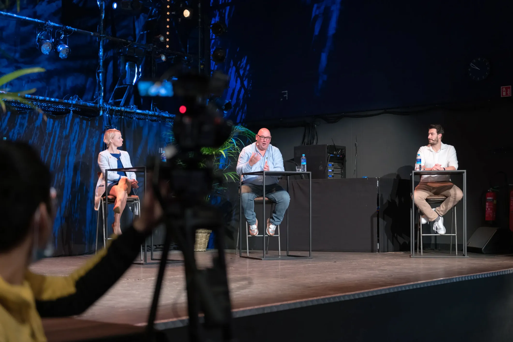 Event photo of a group discussion against a blue background