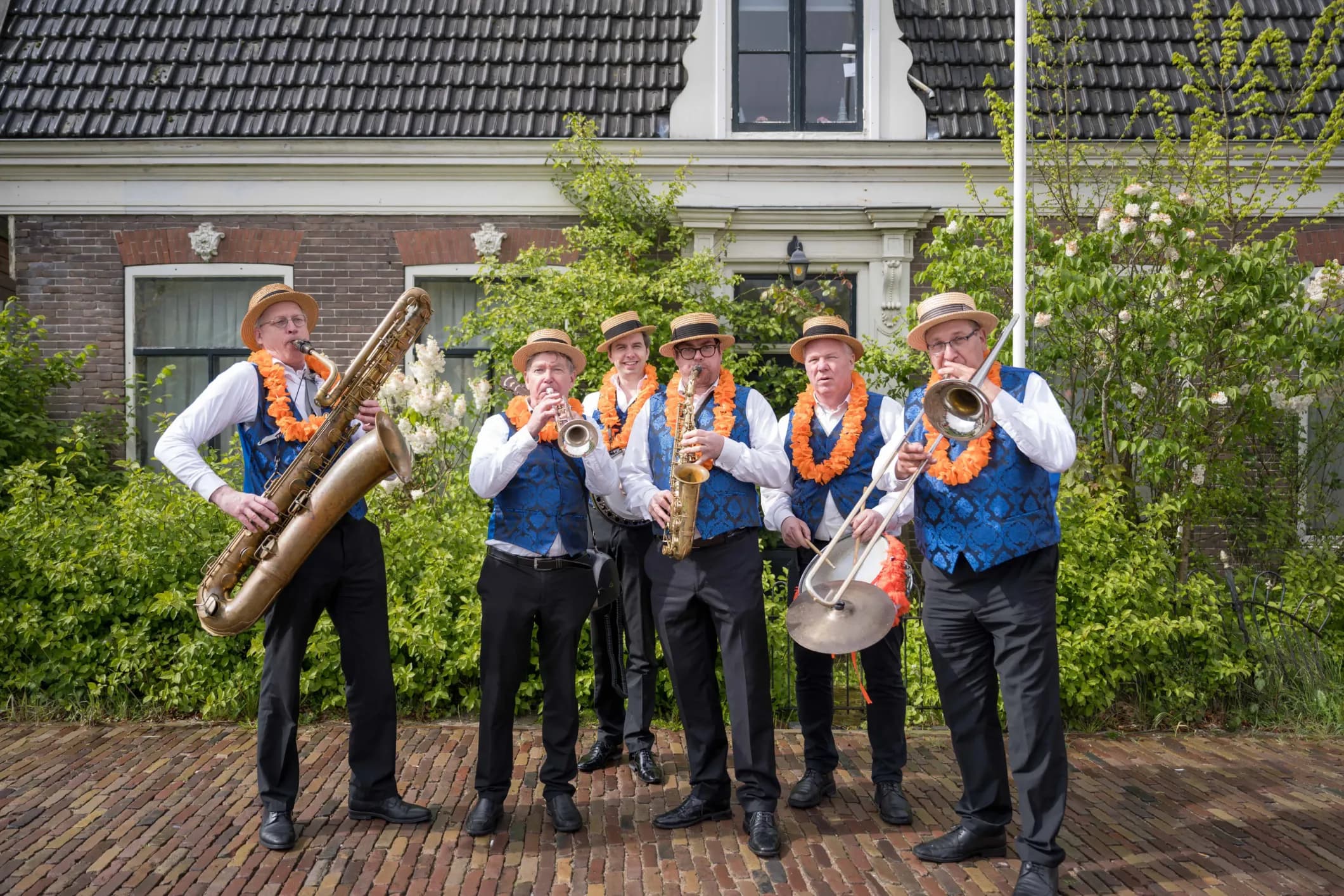 Event photo of a band with orange instruments