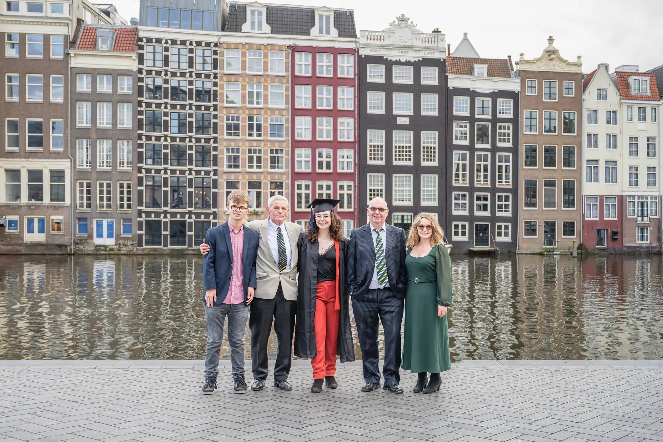 Family photo of a family at an award ceremony by the water in Amsterdam