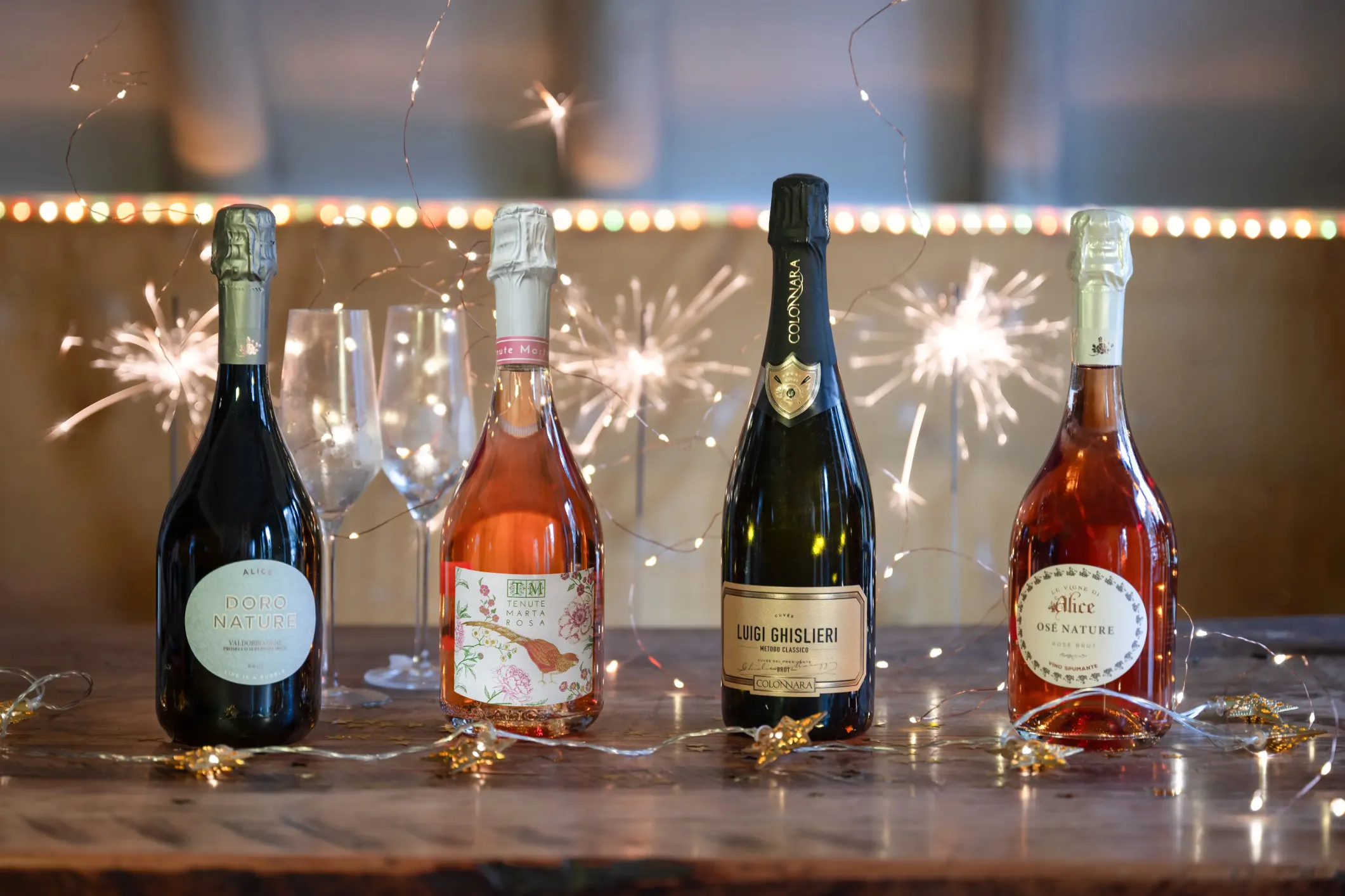 Product photo of a bottle of sparkling wine with sparklers in the background